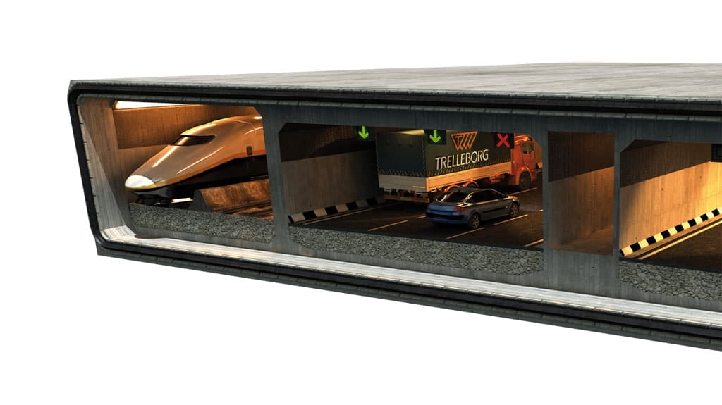 Tunnel mock-up divided in three lines with train in one line and truck carrying Trelleborg container in another