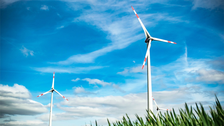 Sustainability blue sky wind power grass