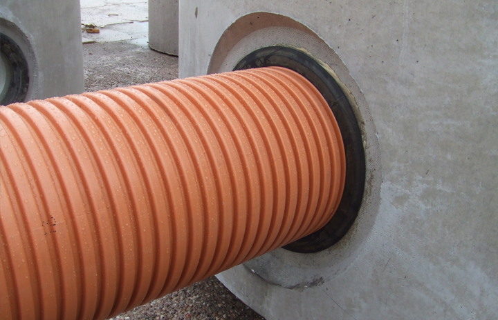 Corrugated pipe connected to a manhole