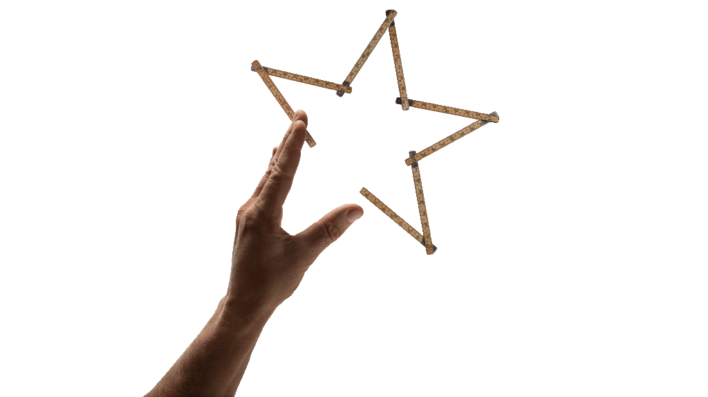 Hand forming a star together with a folding rule