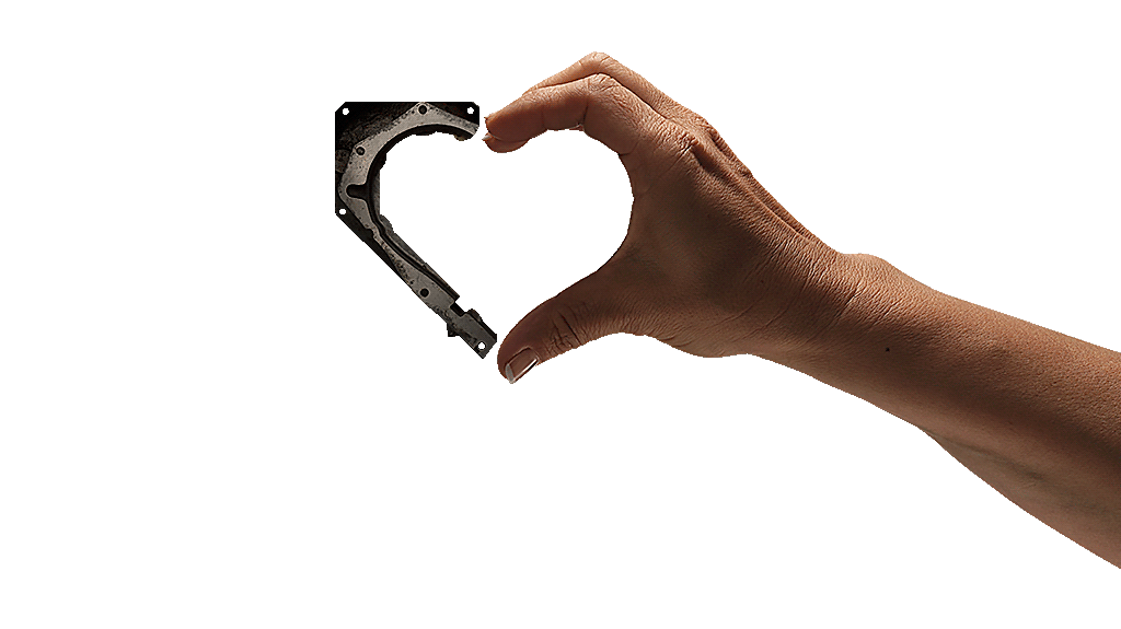 Human hand and a tool shaping the form of a heart