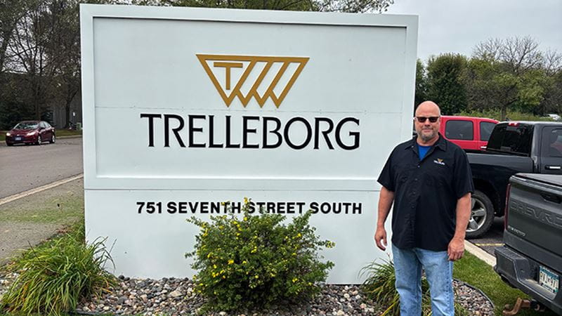 Dave Sunderland next to the Trelleborg logo