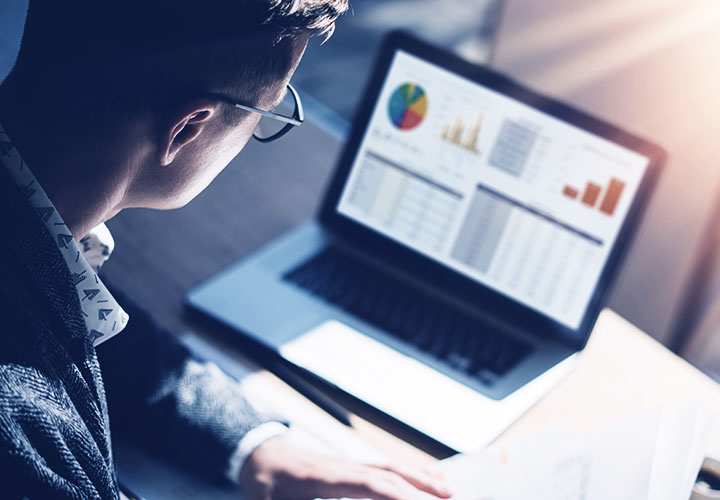 Analyst looking at laptop