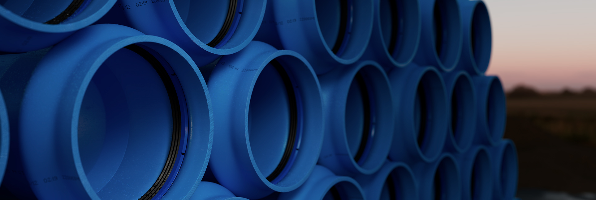 Stacked plastic pipes with angerlock seals