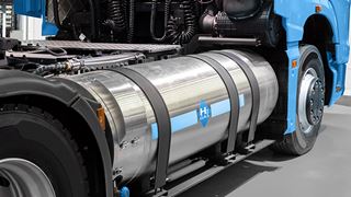 A hydrogen fuel cell semi truck with H2 gas cylinder onboard.