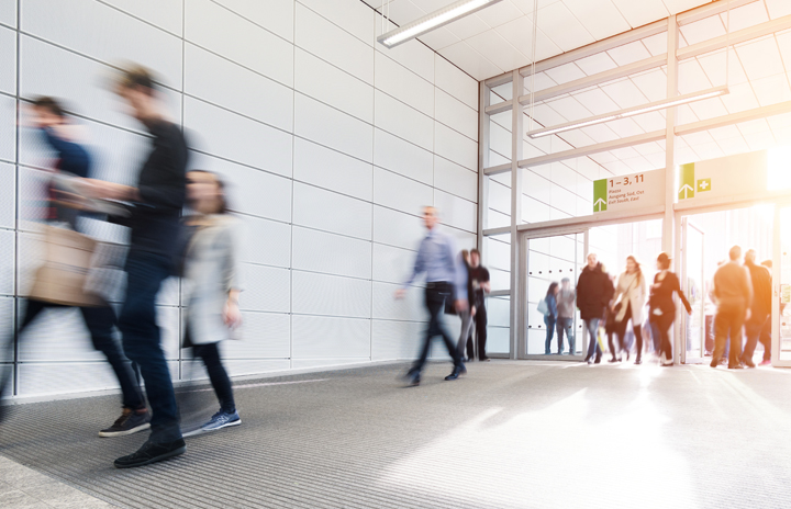 Visitors entering an exhibition center