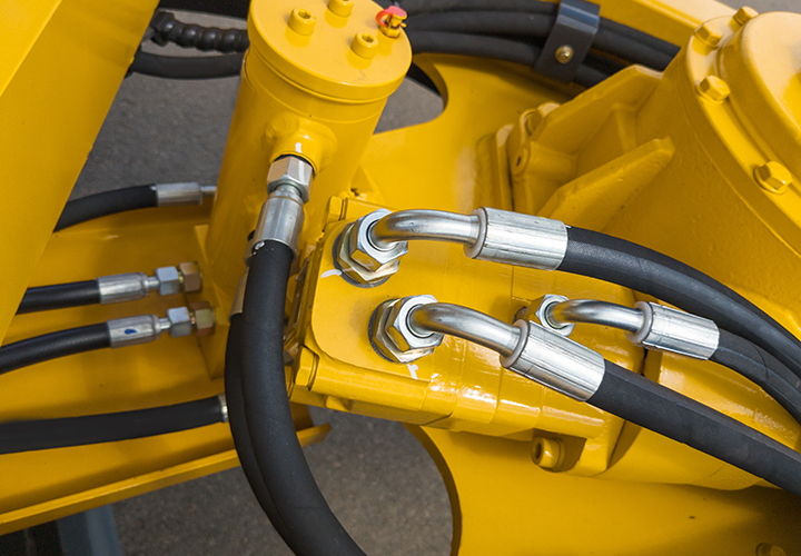 Versatile hose to handle hydraulic fluids, grease, oil-lubricated air, and water under pressure.