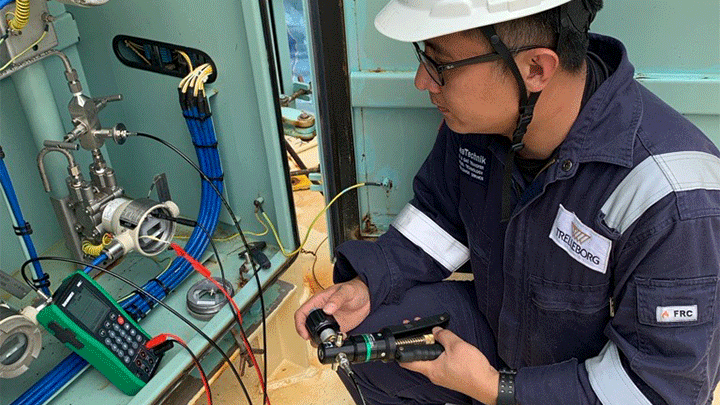 Engineer-inspecting-ship-shore-safety-link-cabinet