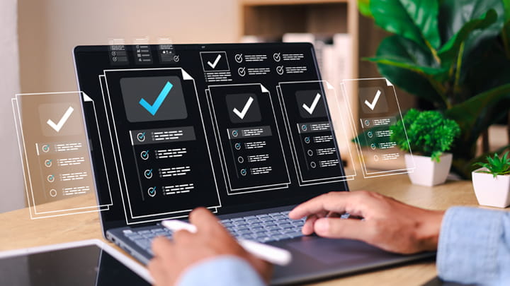 Digital dashboard displaying material evaluation criteria and testing checkpoints on multiple screens.