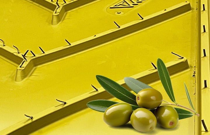 Profile view of a yellow Carryolive conveyor belt with a few olives on it