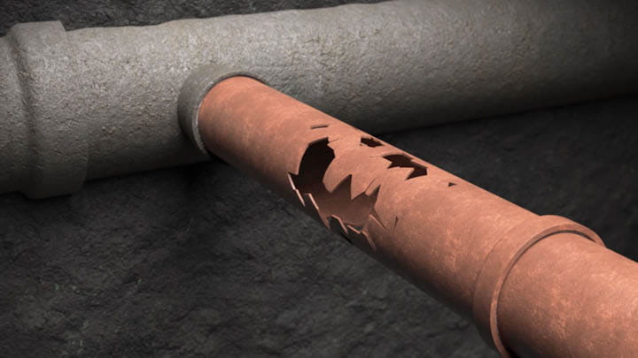 Corroded underground water pipe with severe damage next to intact pipe