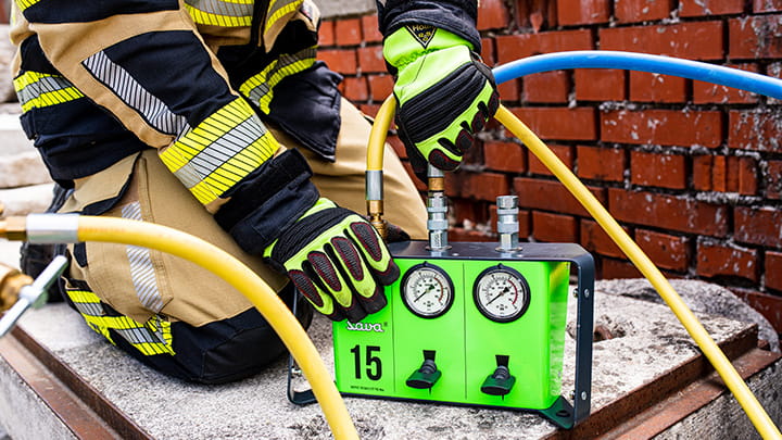 A firefighter handling a Nova lifting bag controller