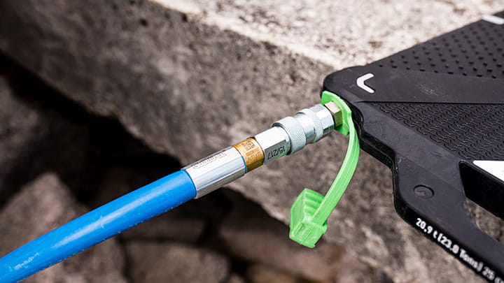 A blue inflation hose connected to Nova