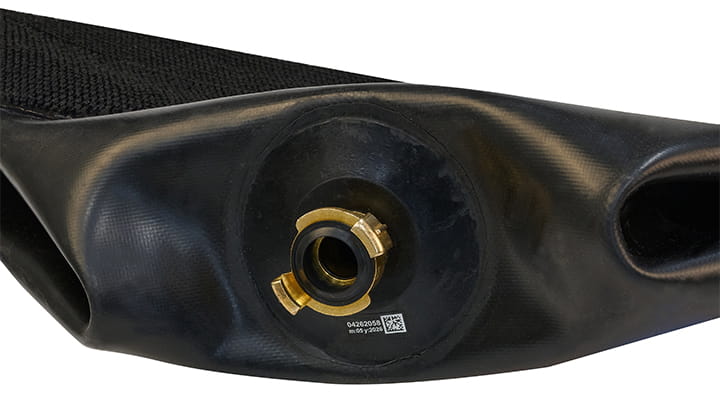 Close-up of the Lyra lifting bag showing the air inlet valve with metallic coupling set into a reinforced black rubber surface.