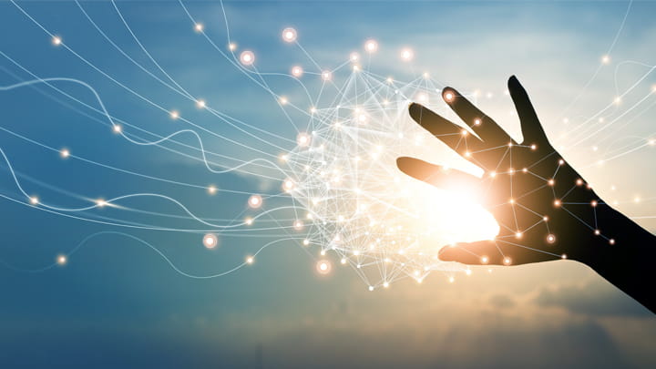 Hand with radiating lines and spots, symbolizing innovation