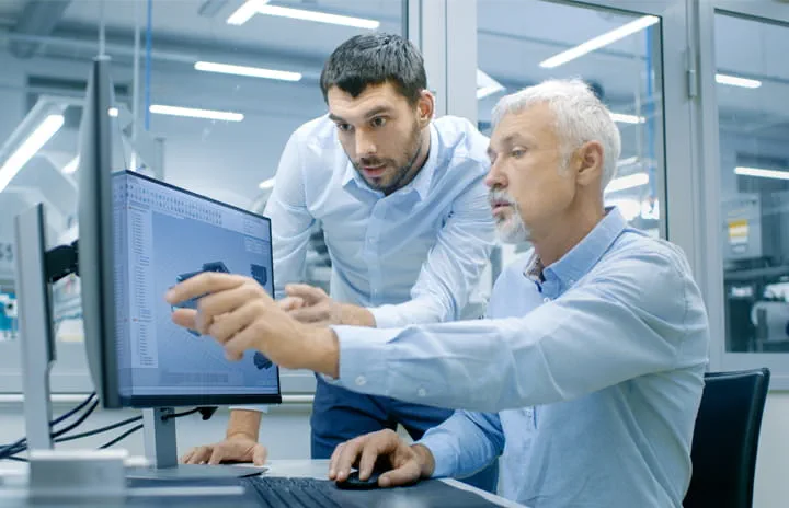 Two guys looking at the screen