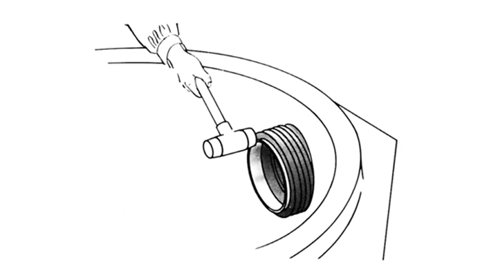 Tapping the Trelleborg 911 Multi Connector into the drilled hole
