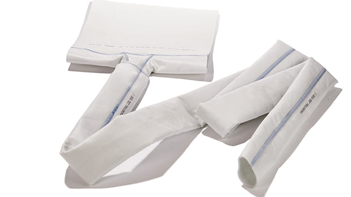 White fabric-textured cylindrical components with curved and angled designs, used in trenchless lateral connection rehabilitation systems