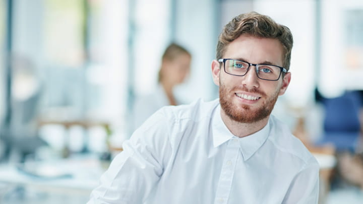 Young smiling business man offering help